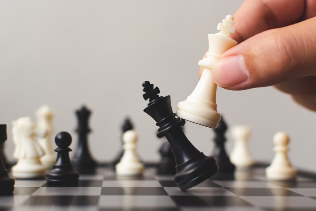 a picture of a hand playing chess